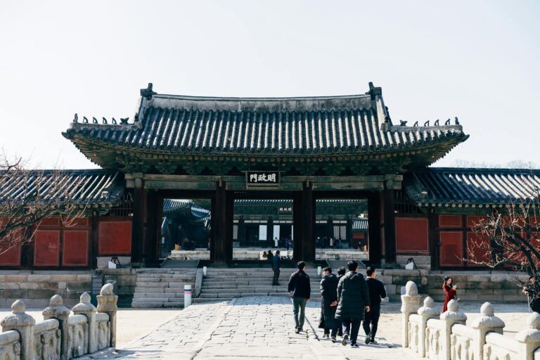 Visitors exploring the ancient Gyeongbokgung Palace in Seoul's cultural heart.
